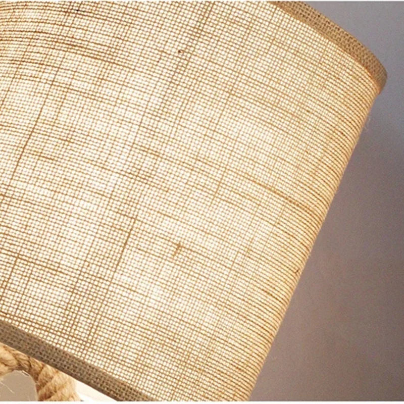 Close-up of a textured beige lampshade against a neutral background
