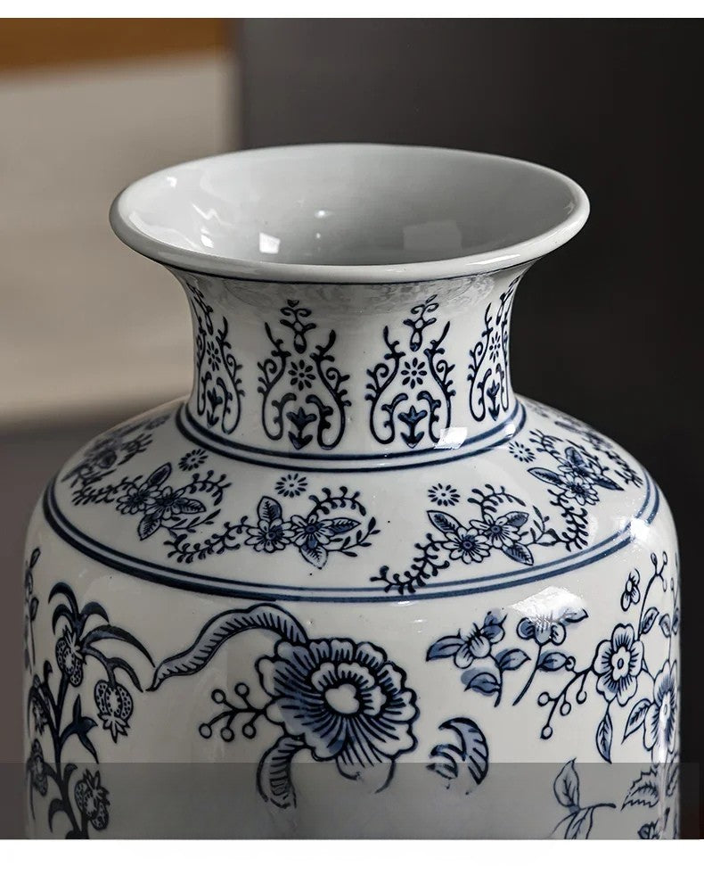 White ceramic vase with blue floral patterns on a blurred background