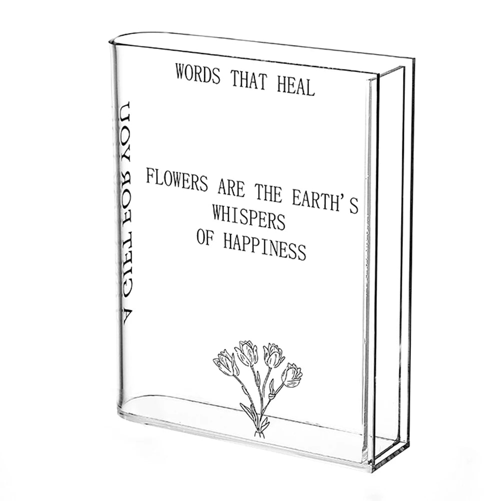 Clear glass block with text and floral design on a white background