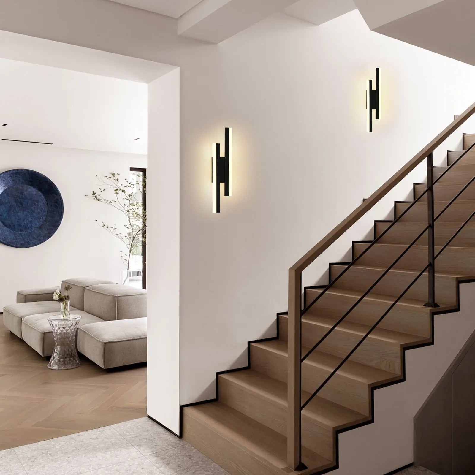 Modern staircase with wall lights in a home interior