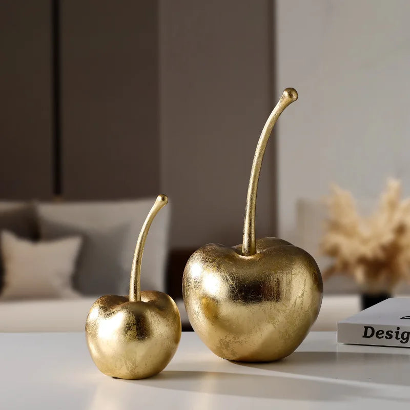 "Decorative cherry figurines on a modern living room tabletop"