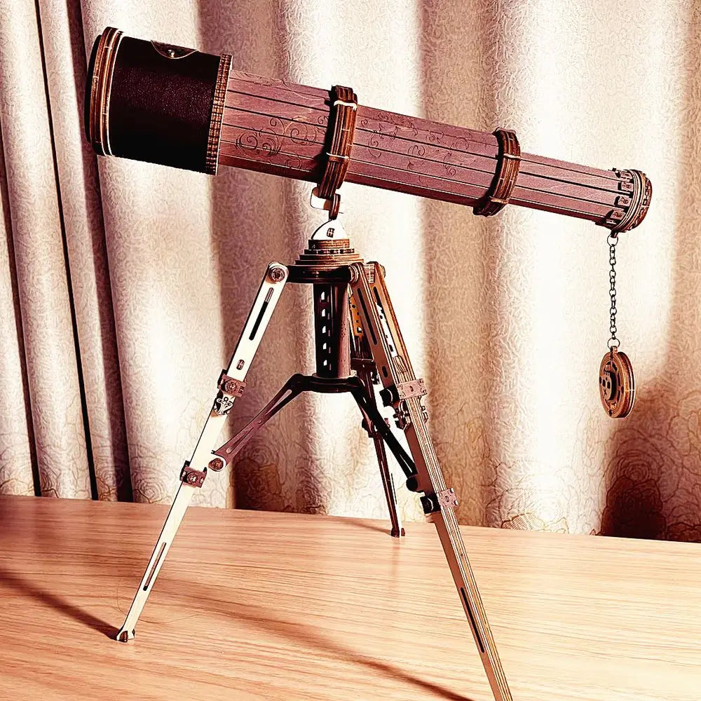 Wooden telescope on a tripod against a beige curtain background