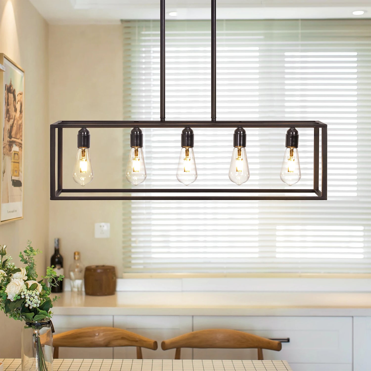 Modern pendant light fixture with five bulbs in a kitchen setting.