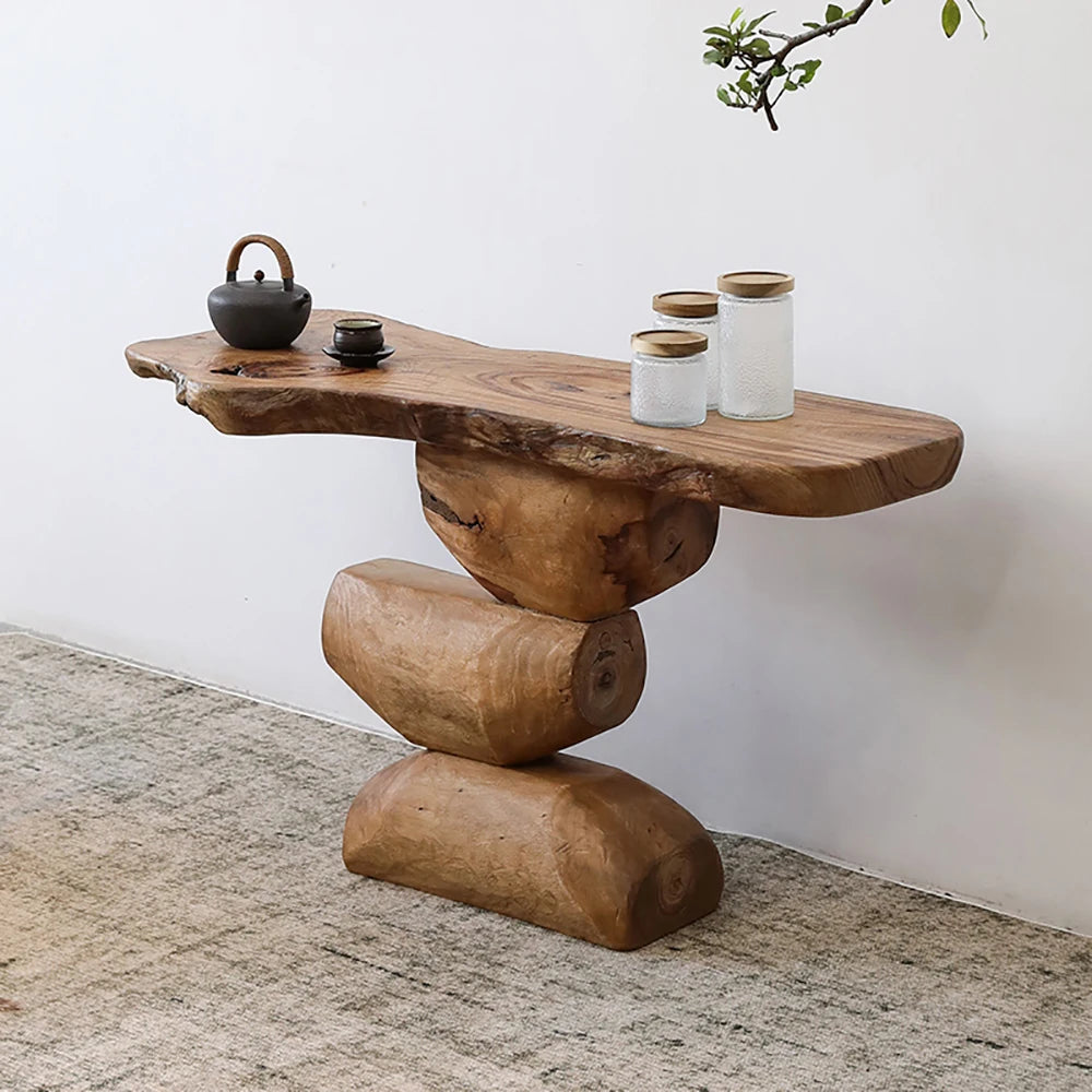 Wooden console table with rustic design against a white wall