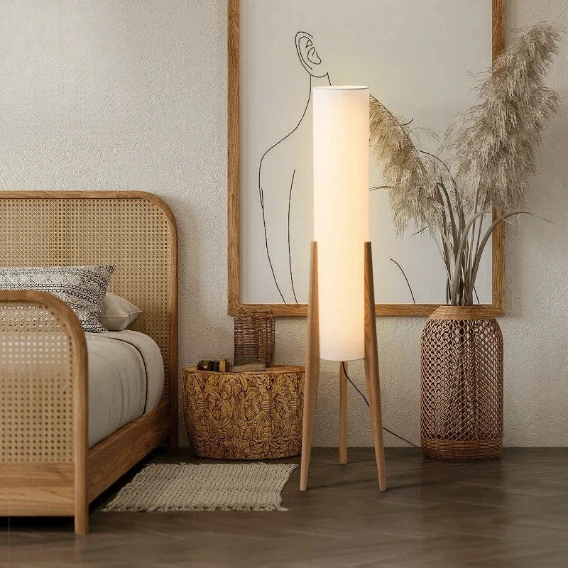 Nestled bedroom with a wooden bed, floor lamp, and decorative elements.