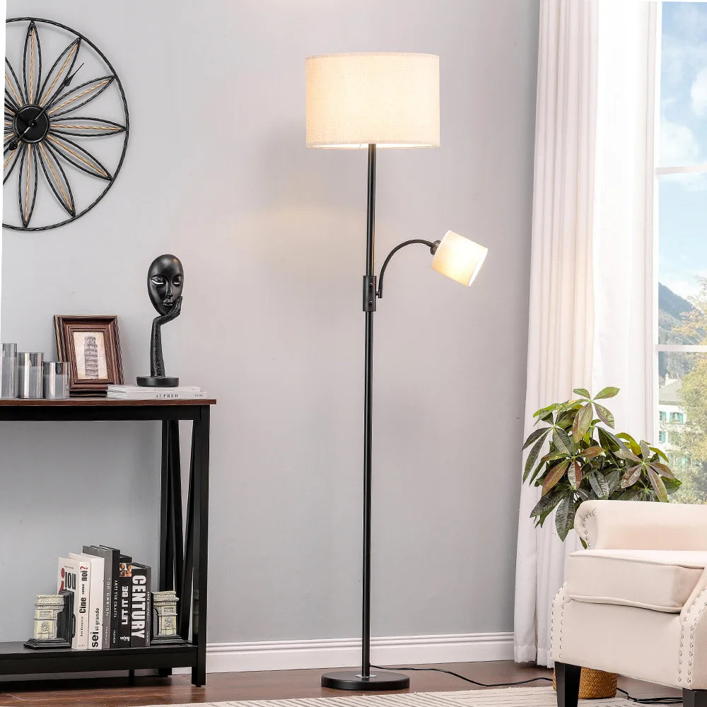 Floor lamp in a living room setting with a reading light extension.