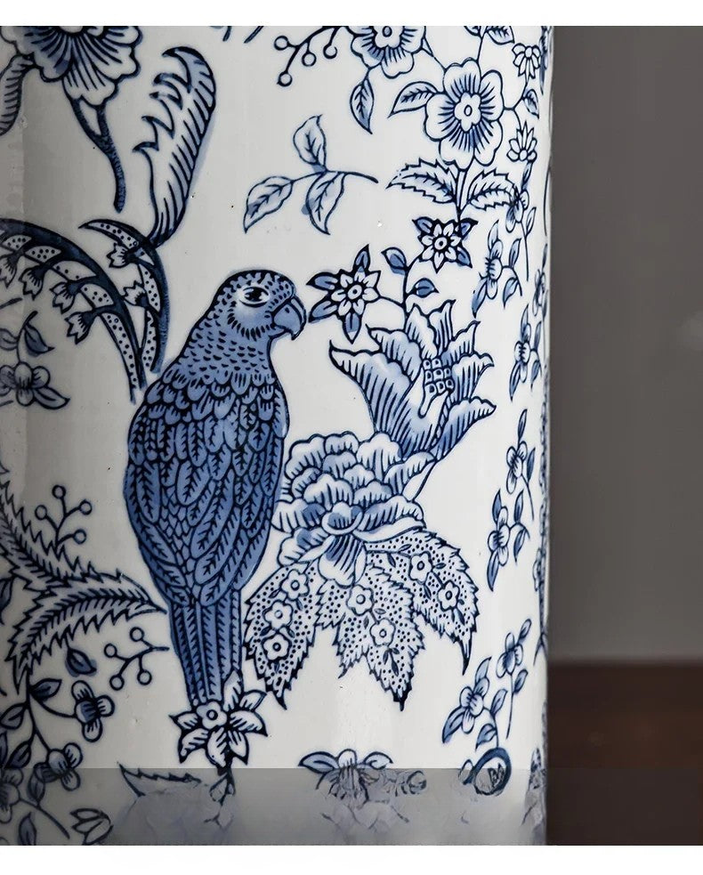 Blue parrot and floral design on a white background