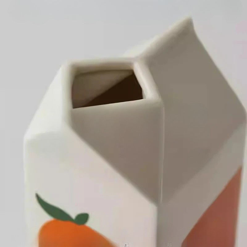 Hexagonal container with a peach design on a white background