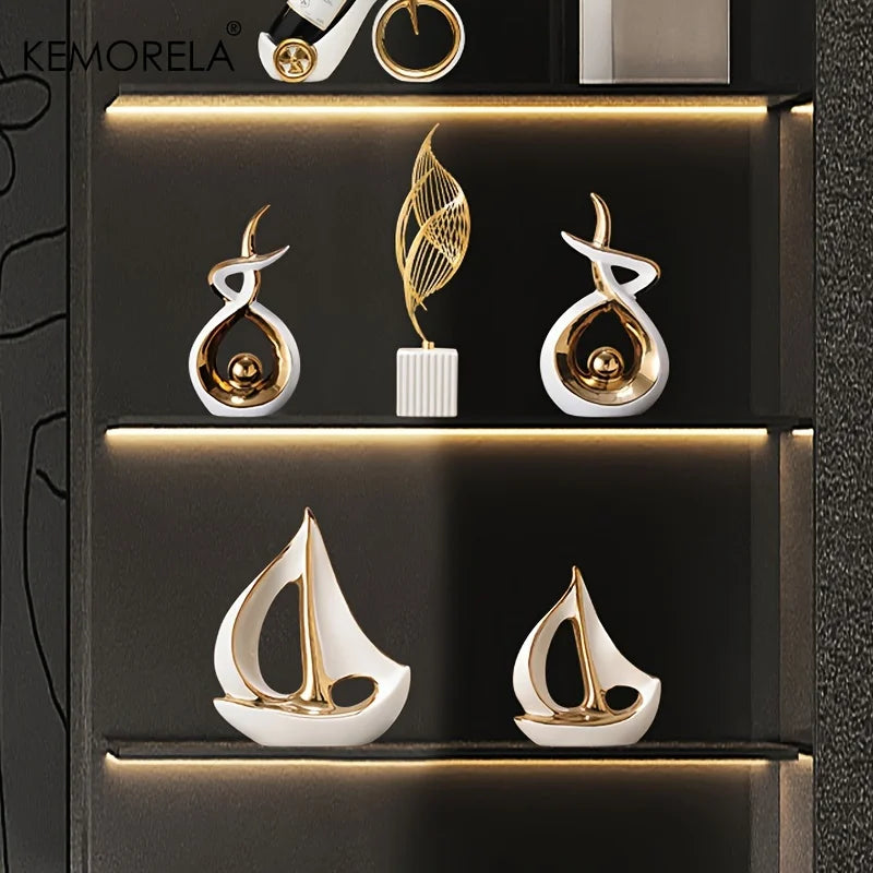 "Luxury ceramic sailboat sculpture in white and gold enamel finish"
