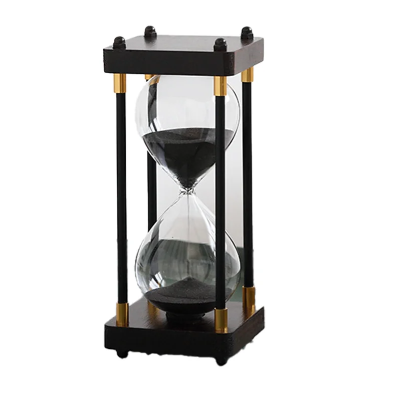 Hourglass with black sand and gold accents on a white background