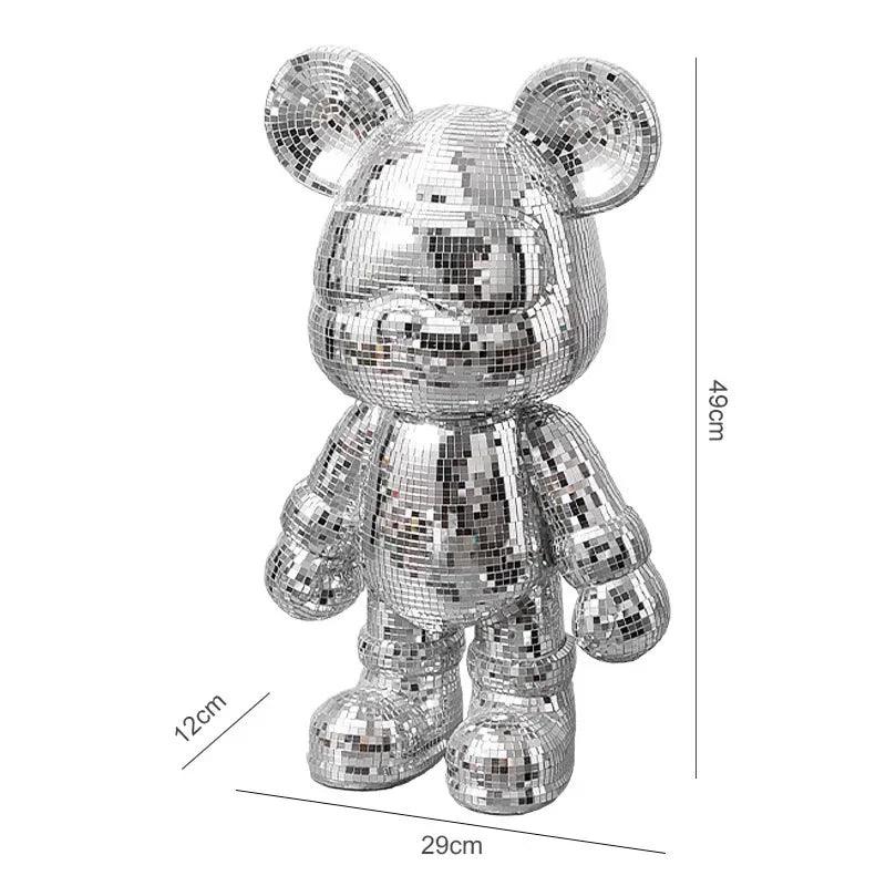 Top-down shot of the DJ Light Bear Statue on a minimalist tabletop.