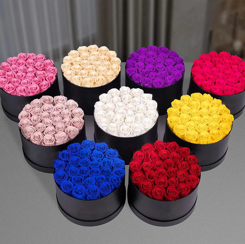 27 preserved roses in a round box on a white background.