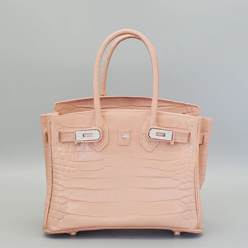 Pink handbag with a textured pattern on a grey background Fashion-style vase for events