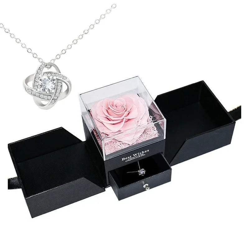 A hand gently holding the heart-shaped box, showcasing its size and elegance.