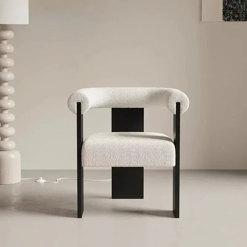 Soft and inviting lambskin upholstered dining chair, adding a touch of luxurious texture to your dining space.