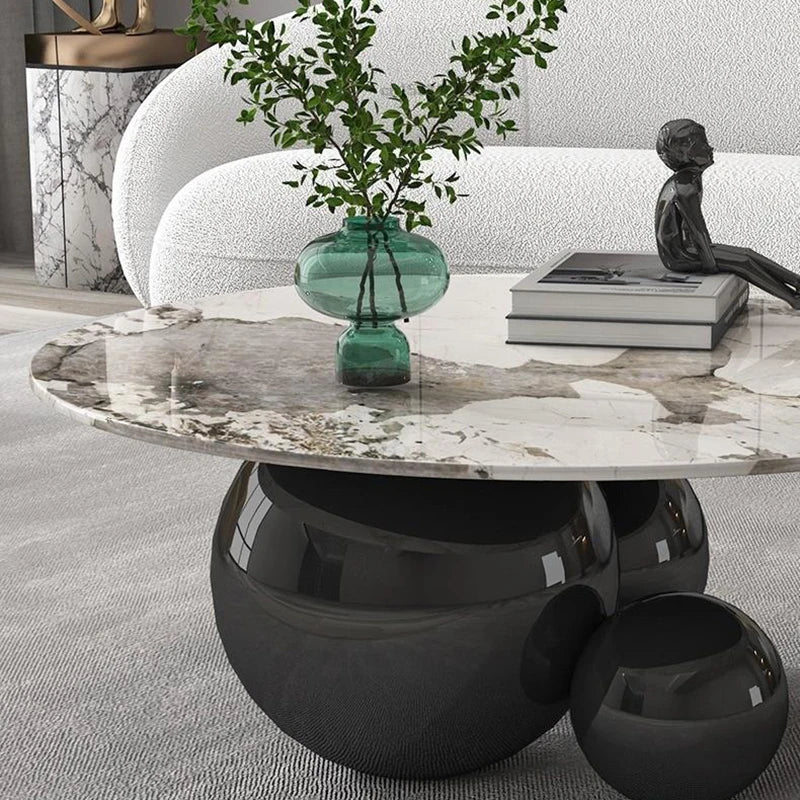 "Compact round metal coffee table for modern interiors, no storage"