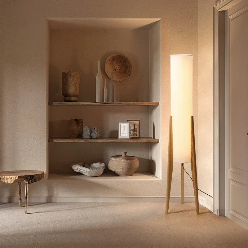 Nestled alcove with shelves displaying decorative items in a softly lit room.