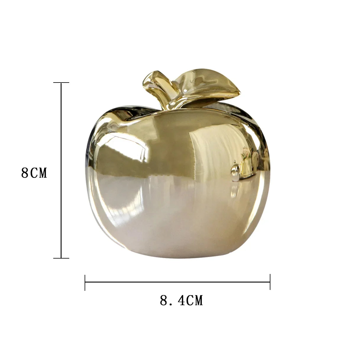 "Golden apple figurine displayed on a stylish mantelpiece"