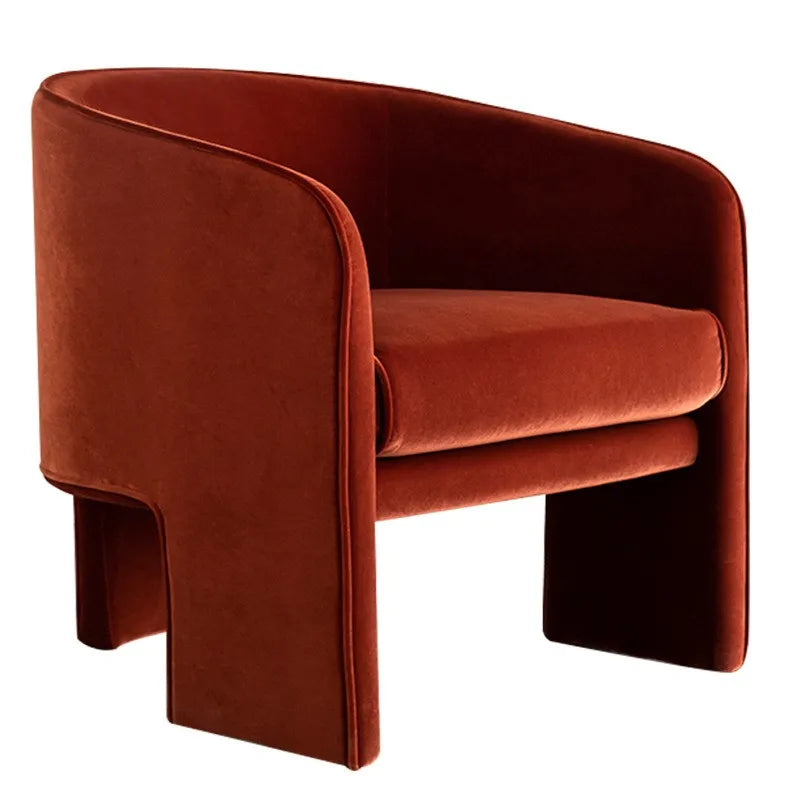 Red velvet armchair on a white background
