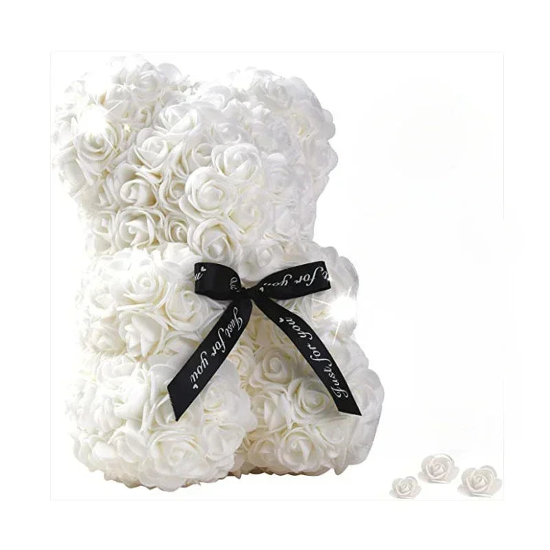 Rose teddy bear displayed in a gift box or on a decorative surface