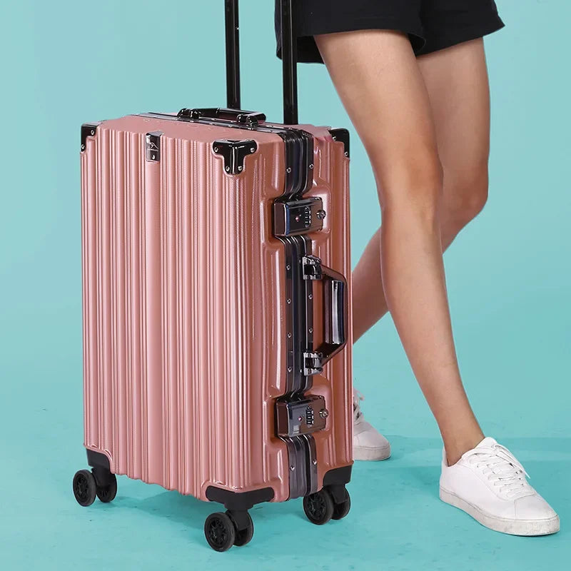 Black 20-inch aluminum frame rolling luggage with TSA lock and spinner wheels.