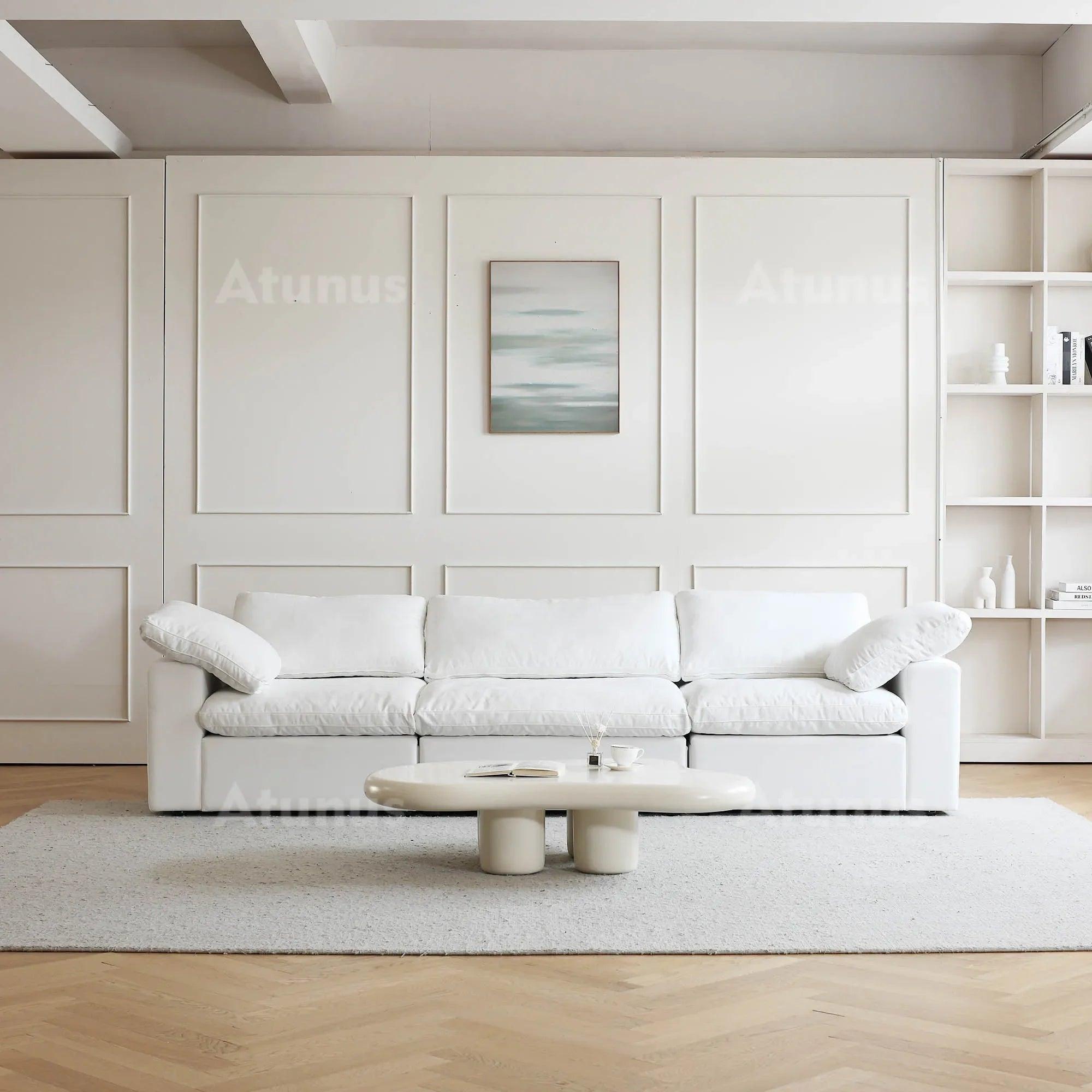Comfortable white couch with chaise for contemporary decor.