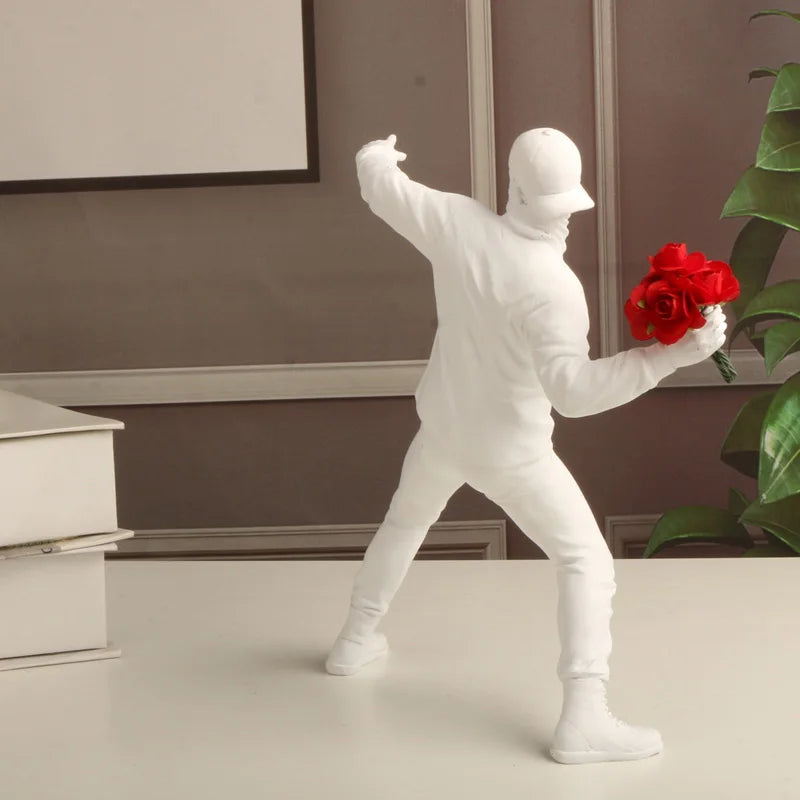 "Resin figurine inspired by Banksy’s Flower Thrower artwork"