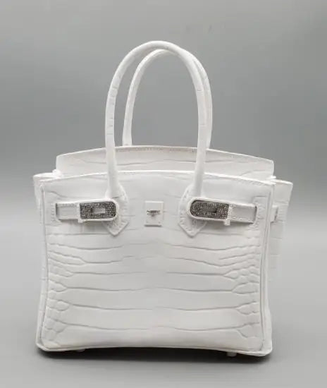White handbag with silver hardware on a Gray background Elegant living room centrepiece
