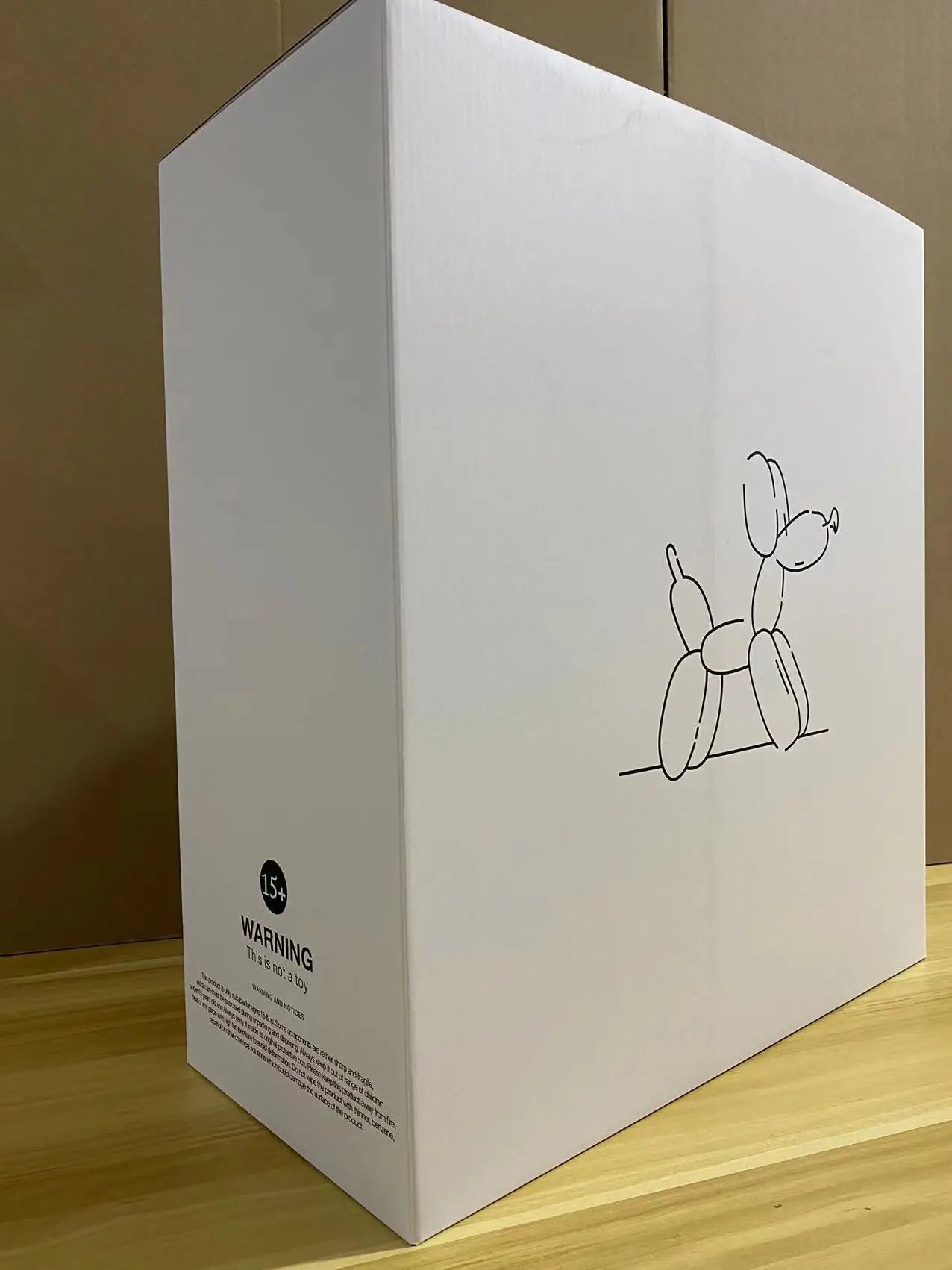 The JONLALA balloon dog sculpture in its color box, ready for gifting