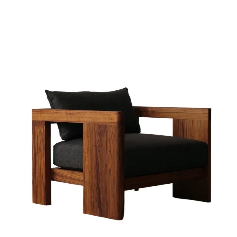 Wooden armchair with black cushions on a white background