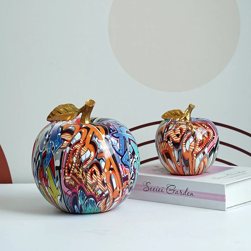 "VILEAD resin graffiti apple figurine on a living room table"