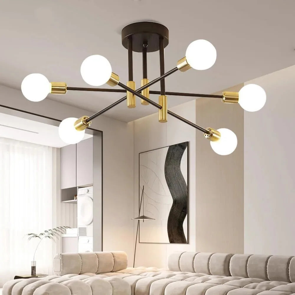 Modern chandelier with gold and black design in a living room setting.