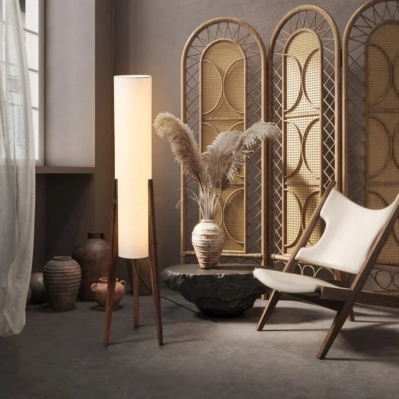 Modern interior with a floor lamp, chair, and decorative elements.