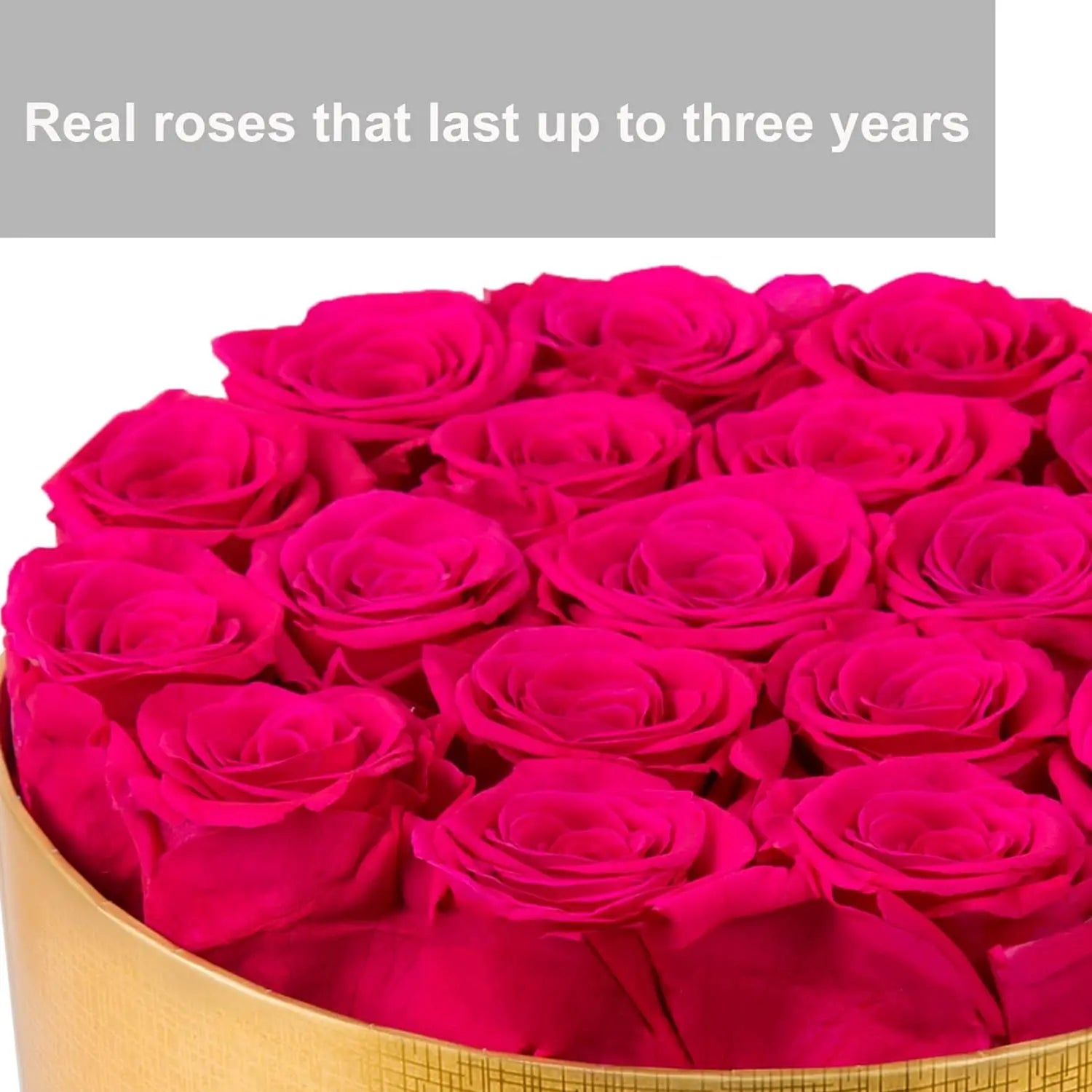 Luxurious gold and black round box filled with preserved roses.