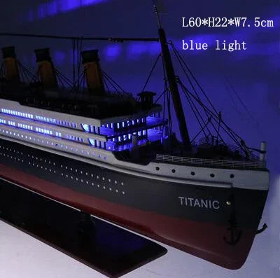Detailed view of the guardrails, chimney, and lifeboats on the sailboat model.