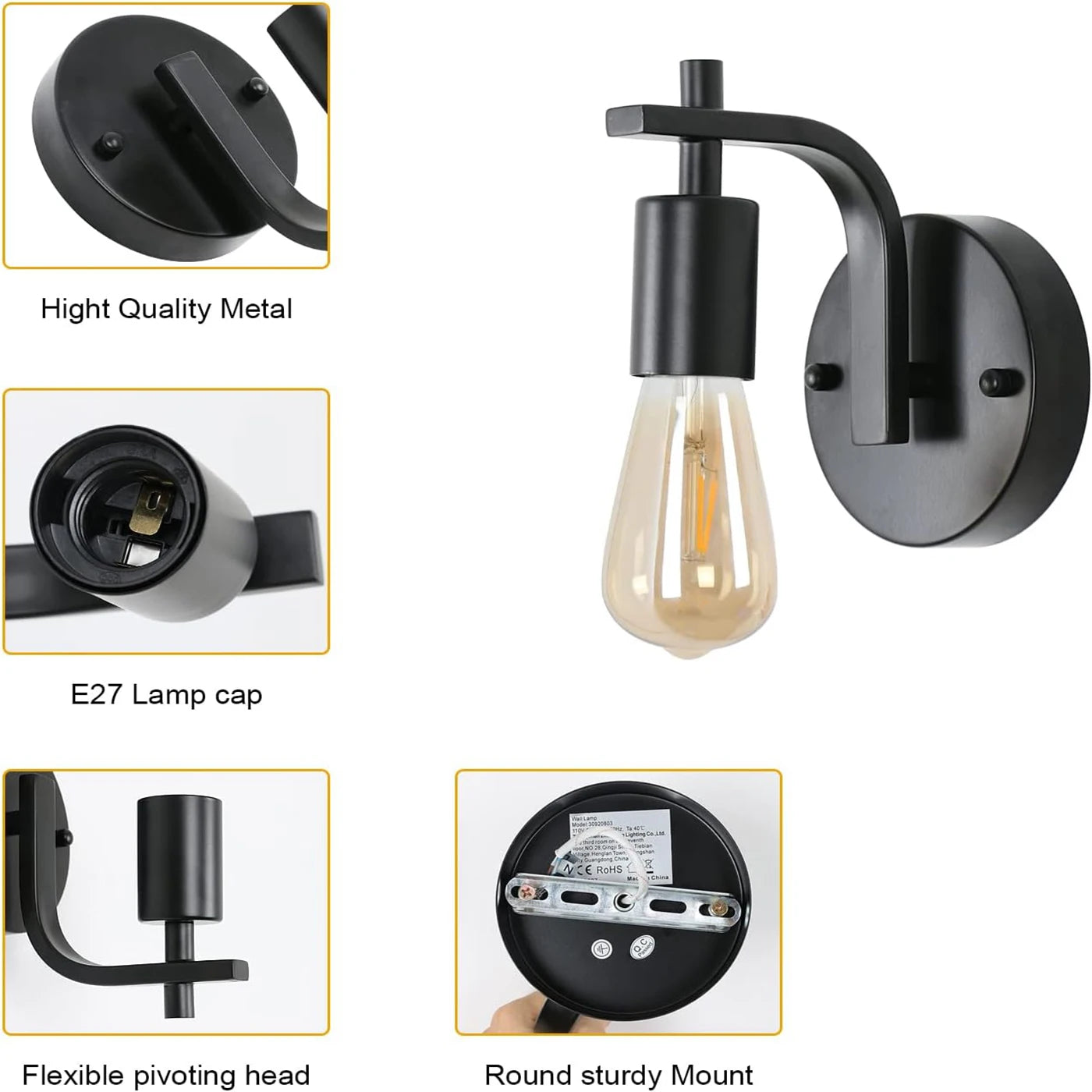 Black wall-mounted light fixture with detailed features on a white background