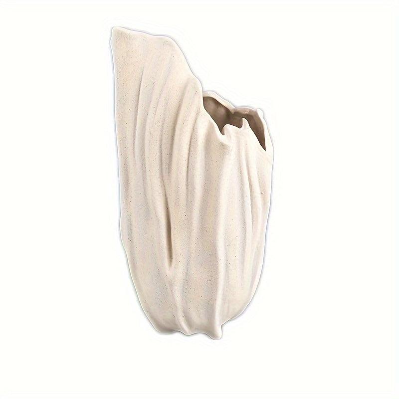 Simple white ceramic vase for versatile home decoration.