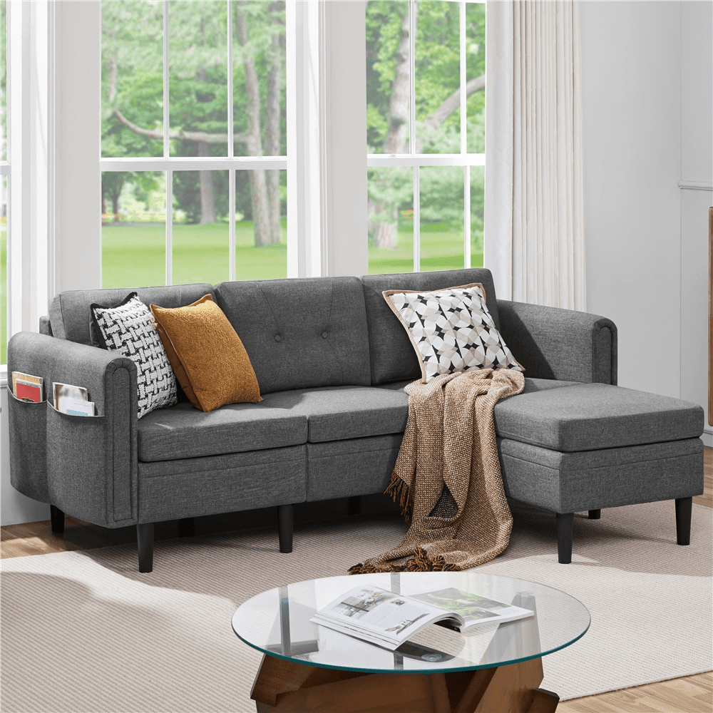 Modern L-shaped sofa with ottoman in a cozy living room.