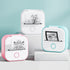 Two small printers, one pink and one blue, with printed designs on a light blue background.