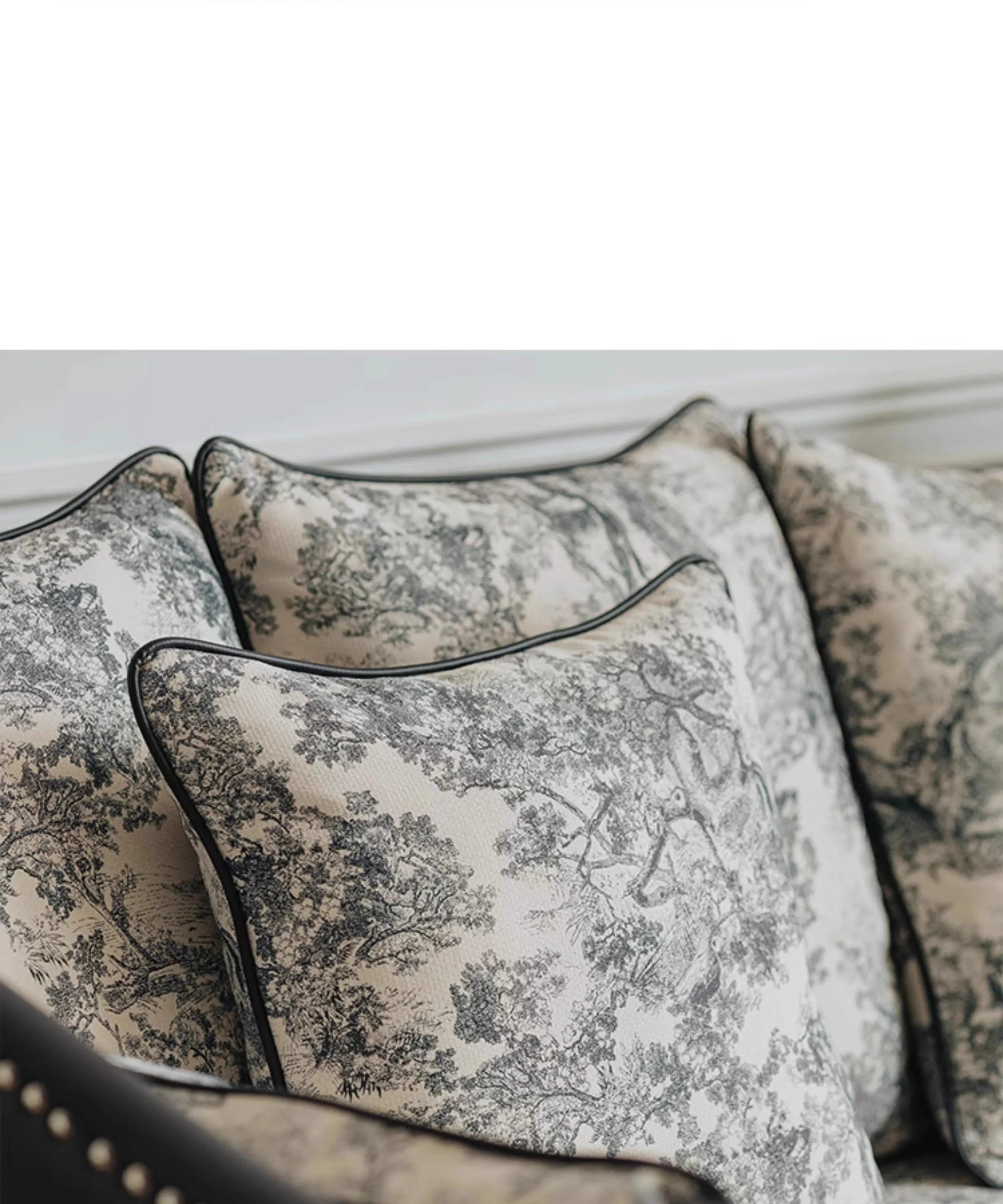 Decorative pillows with floral pattern on a sofa