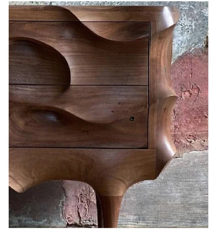 Wooden side table with wavy design on a textured surface