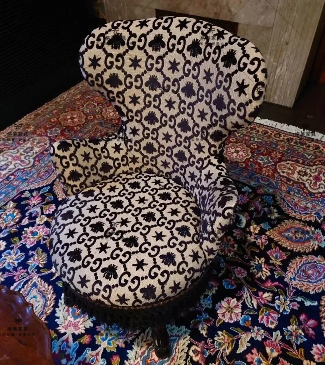 Decorative chair with black and white pattern on a colorful rug