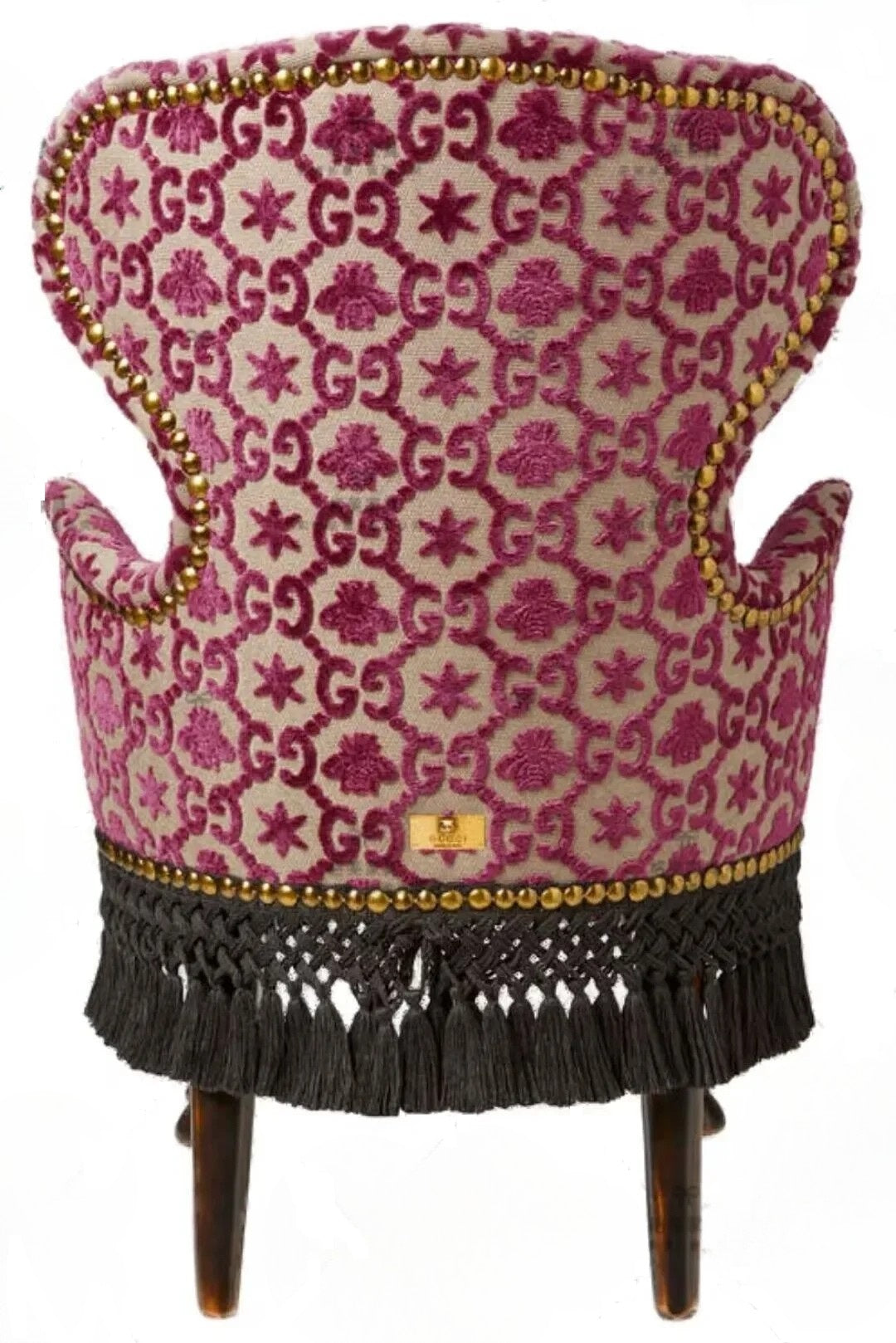 Decorative chair with pink patterned fabric and tassels on a white background