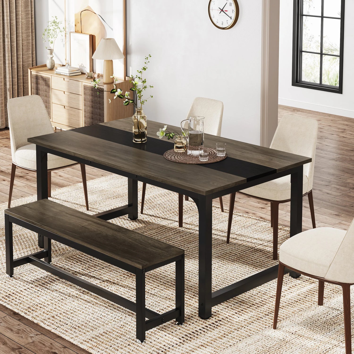 Dining room setup with a dark wooden table, chairs, and bench on a wooden floor.