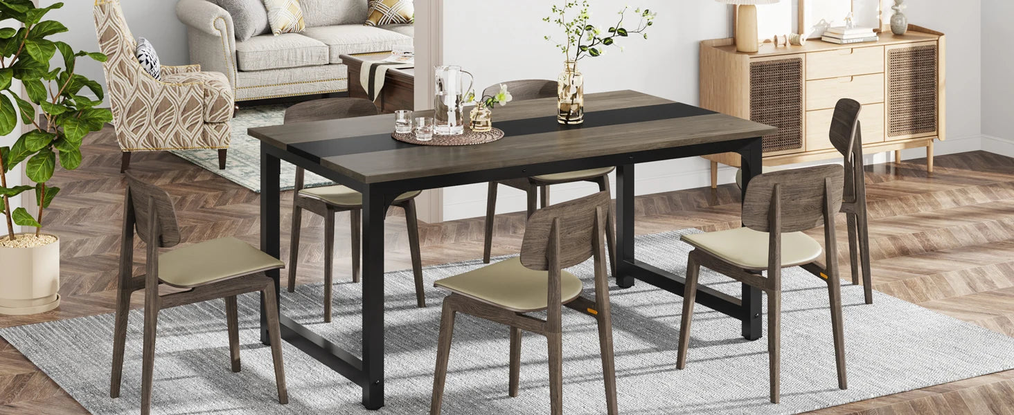 Dining room setup with a table and chairs in a home interior.