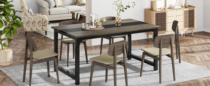 Dining room setup with a table and chairs in a home interior.