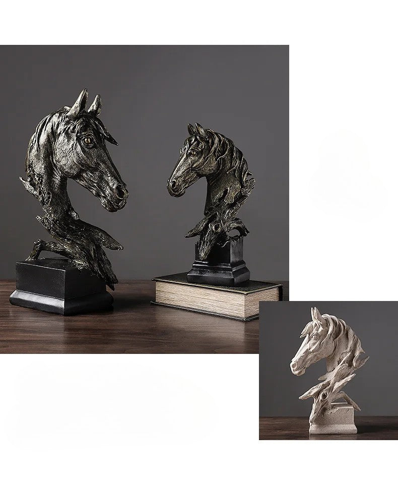 Bronze horse head sculptures on books with a dark background