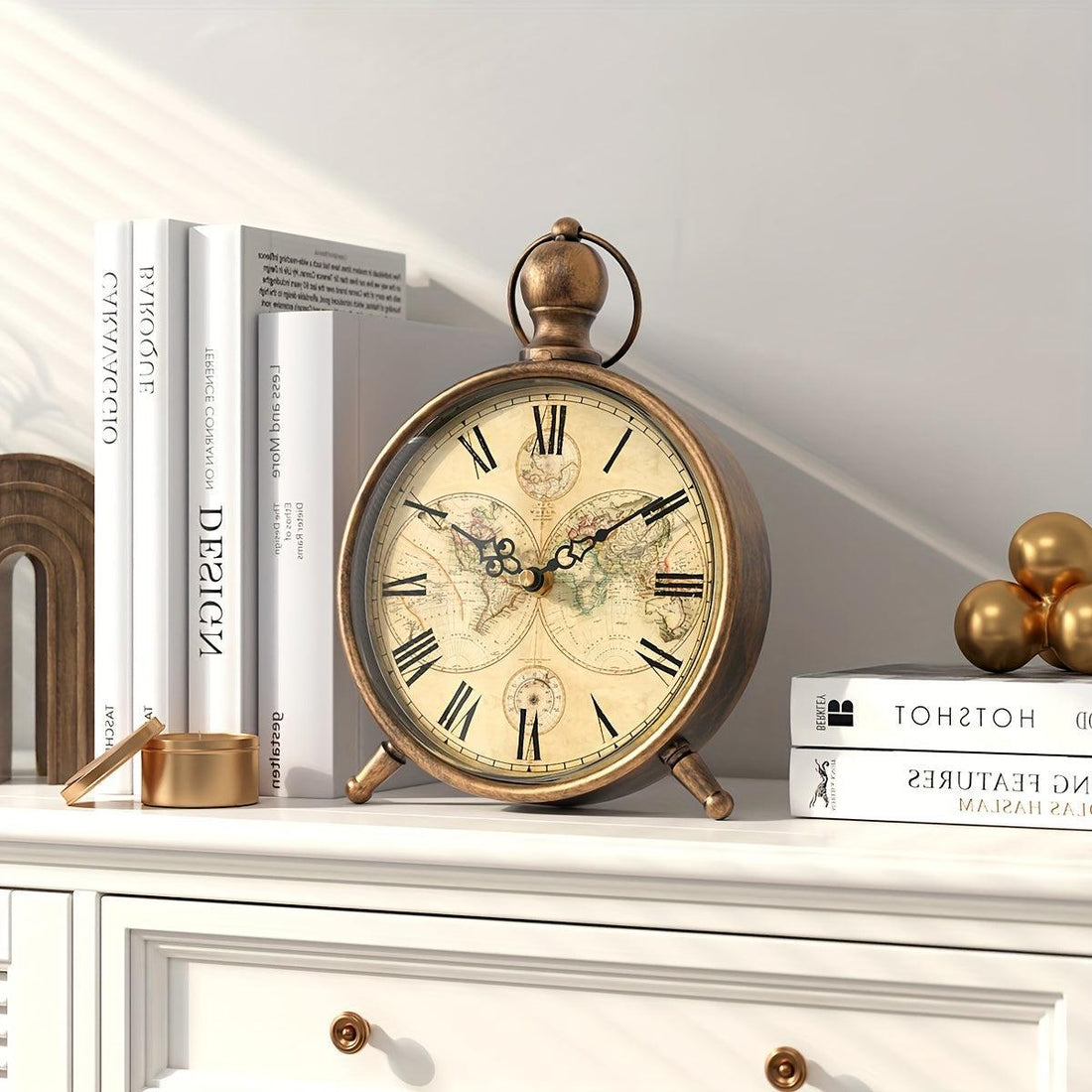 Vintage European-style desk clock with a world map face and metal design.