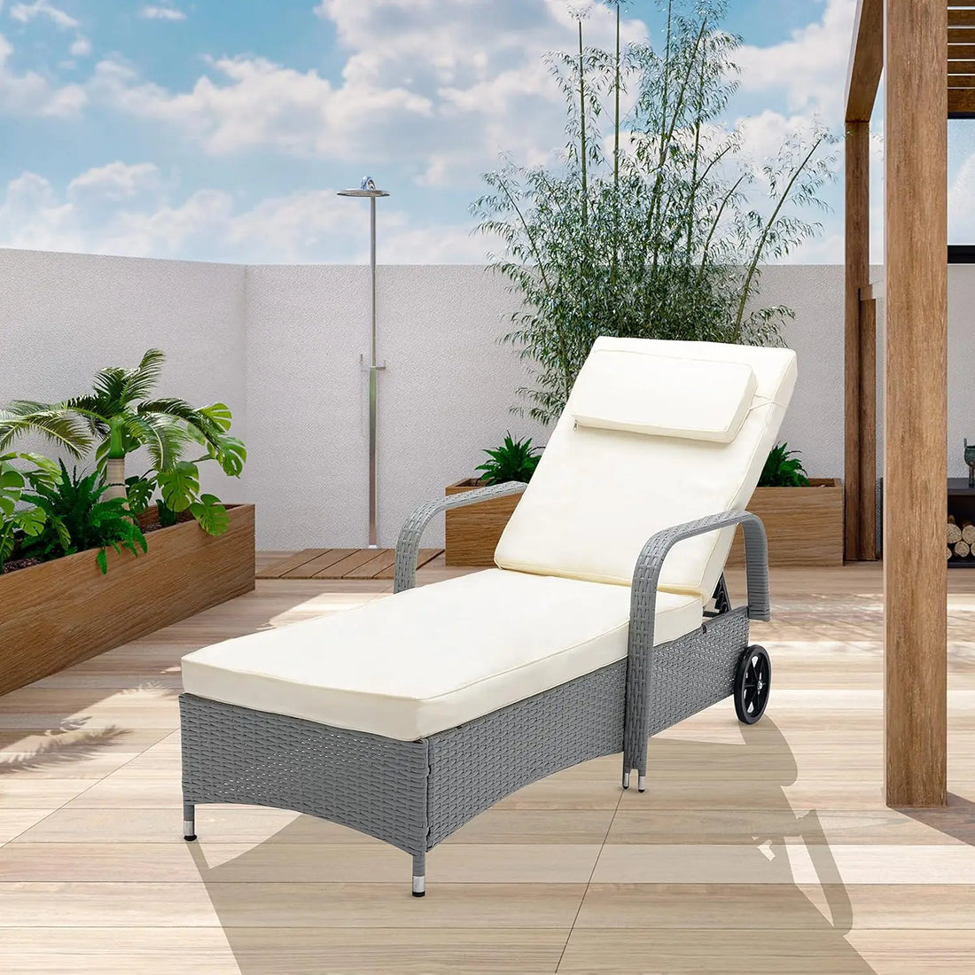 Grey rattan recliner sun lounger with adjustable backrest for garden