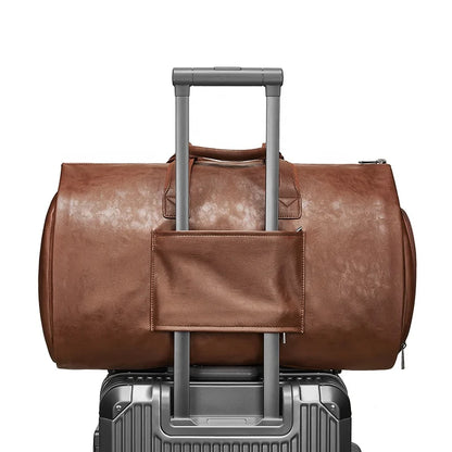 Brown leather duffel bag with wheels on a white background
